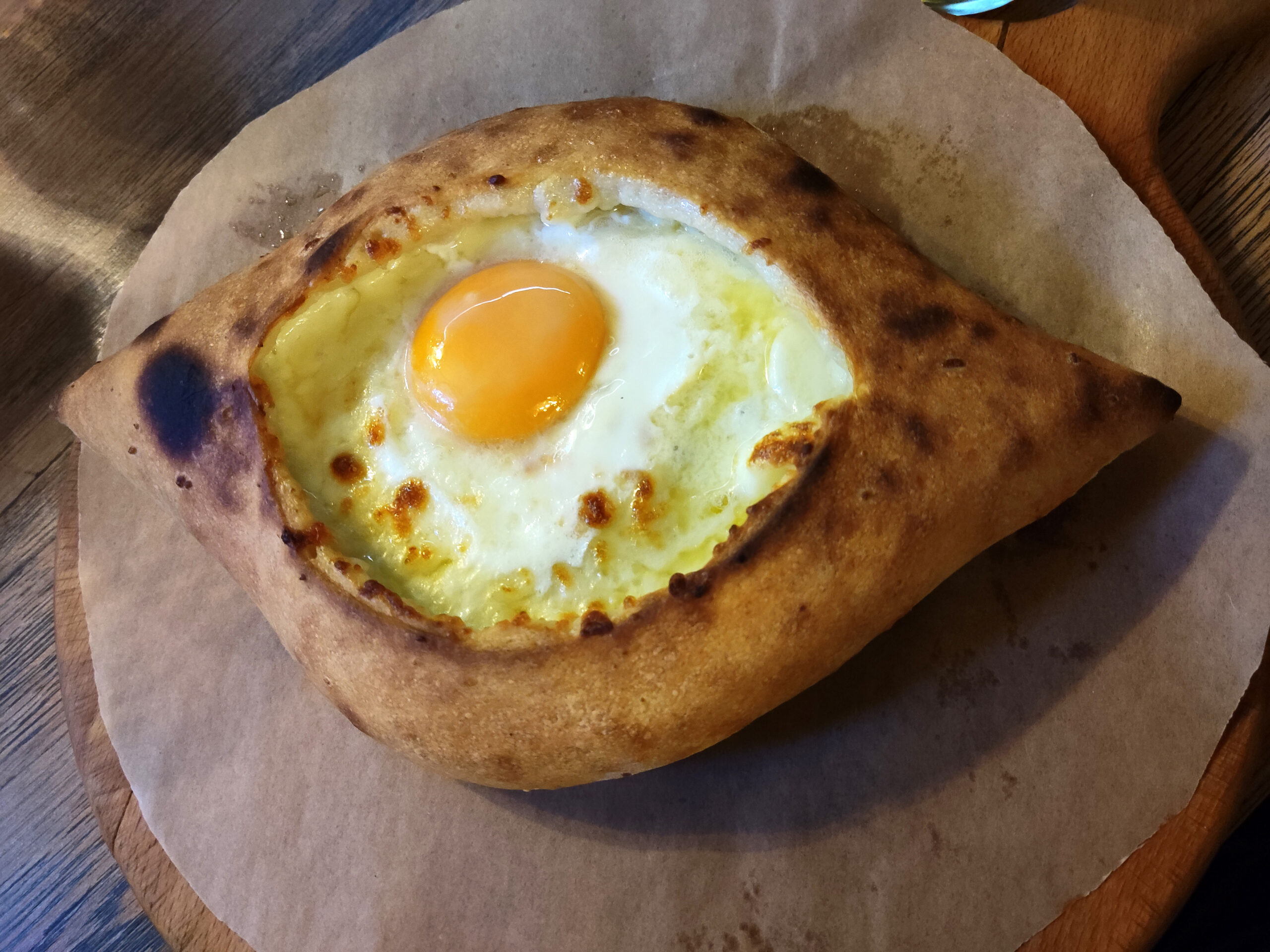 The Georgian bread boat with an egg cracked into the middle