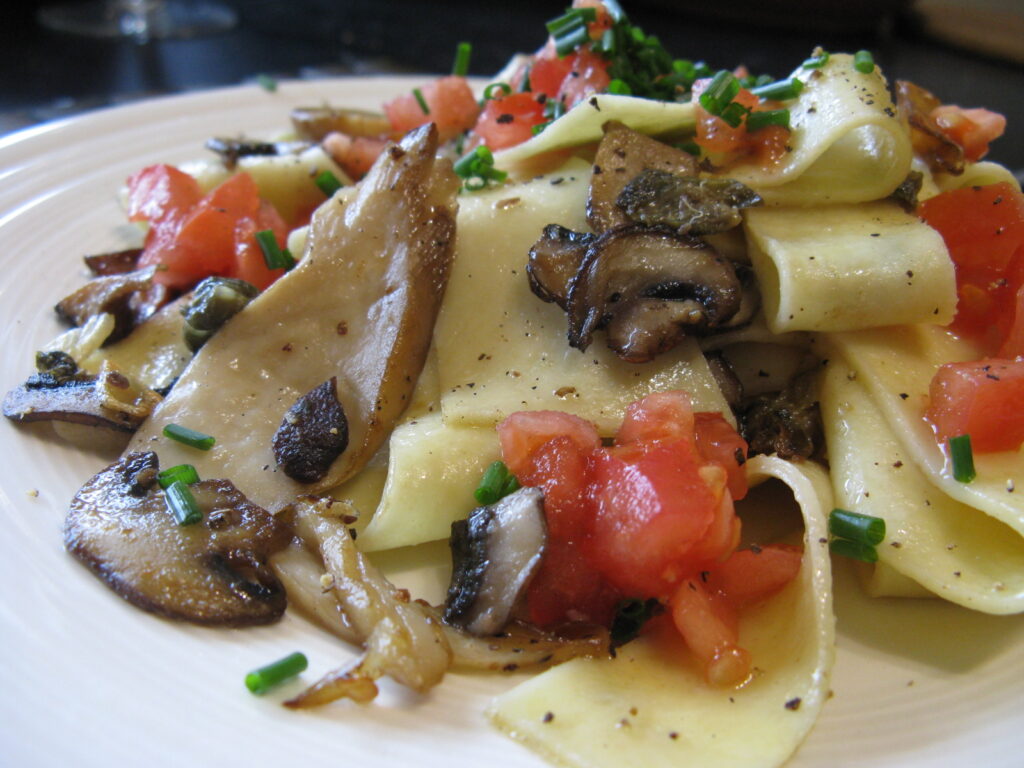 Thick white mushroom stems sliced into rounds and scored across the cut faces